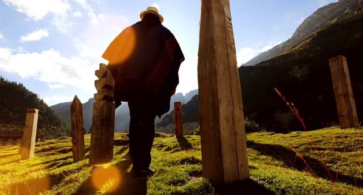 Man with Pancho and Hat Walking Through Sacred Land in Peru