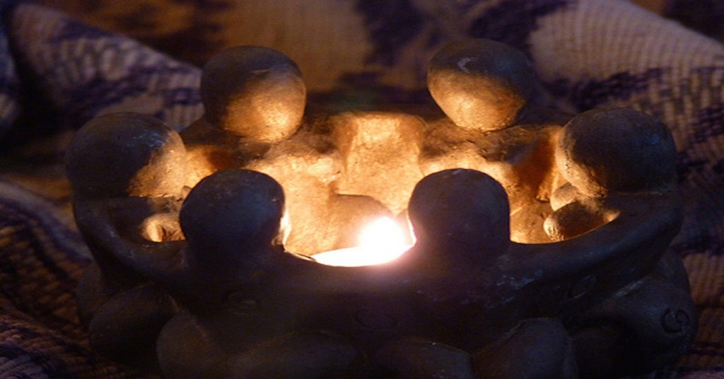Clay Human Figures Encircling a Flame