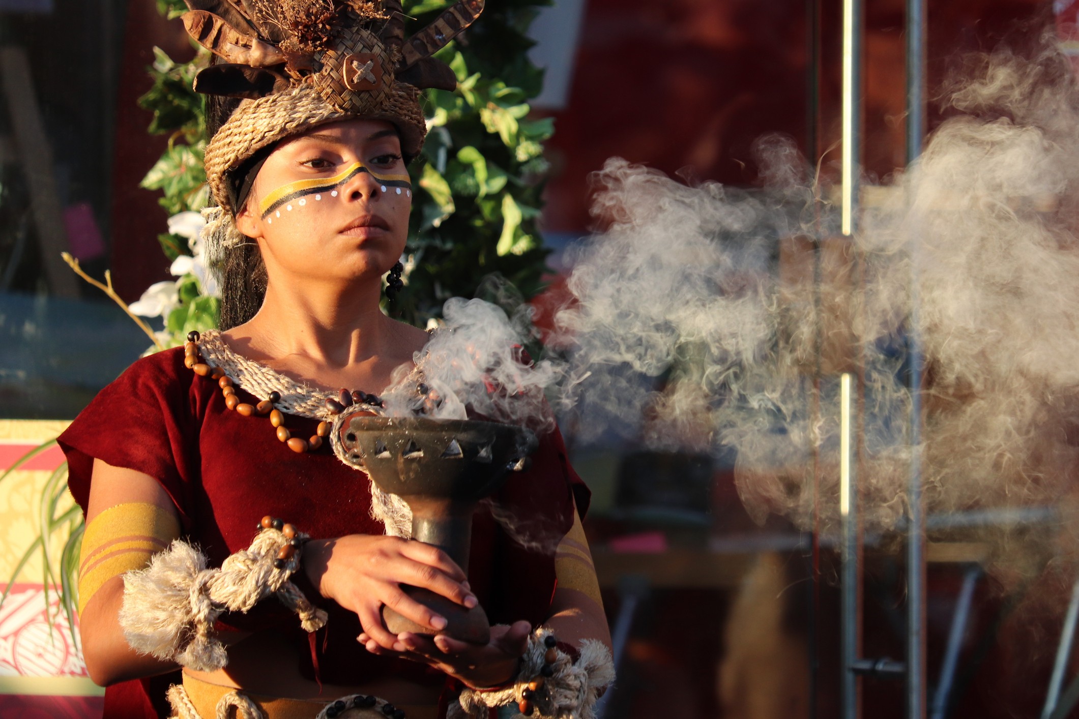Mayan Priestess performs an ancient ritual of fire in Manezh square, Moscow, during the historical festival of Times and Epochs.