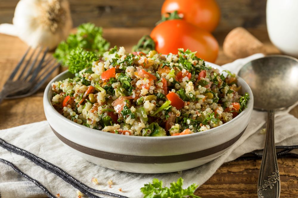 Bowl of Quinoa Salad with Garlic, Tomatoes and Parsley