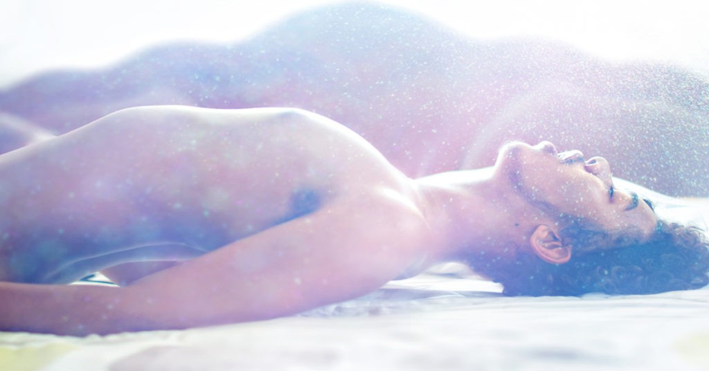 Man Laying Down with Raised Chest and Mouth Open