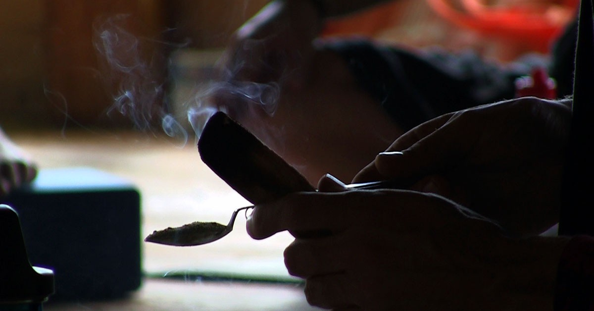 Person Using Ceremonial Smoke to Cleanse