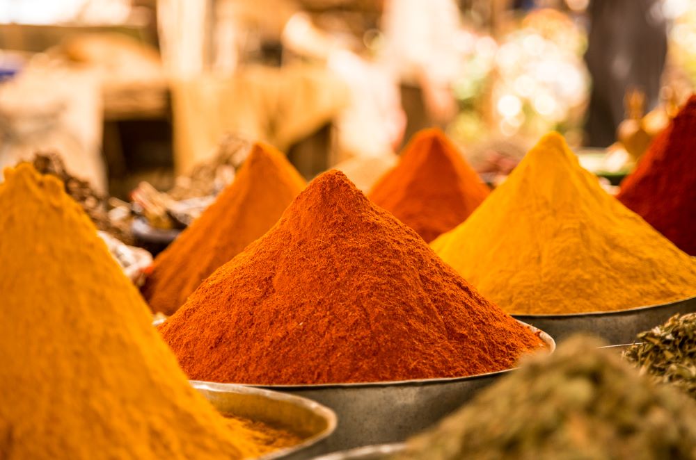 Mounds of Red, Yellow and Orange Powdered Spices