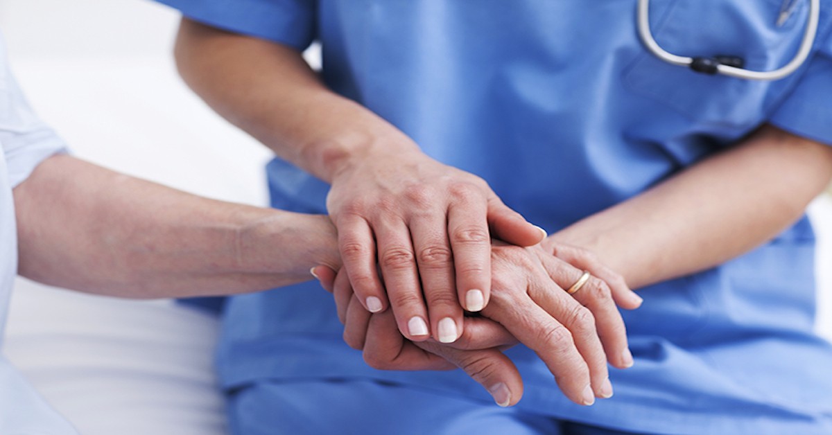 Nurse Holding a Patient's Hand