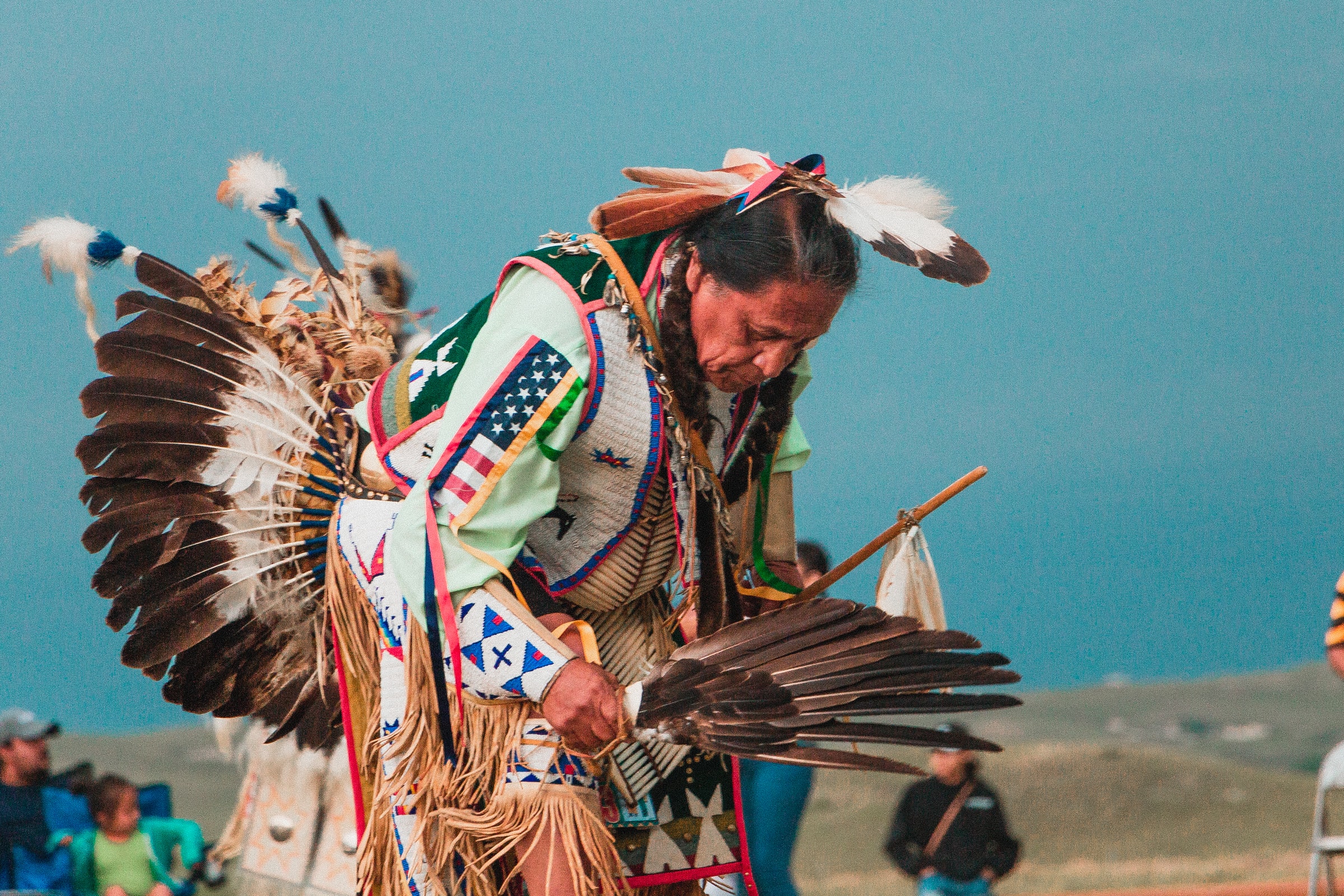 Native American Man Dances in Traditional Ceremony Attire