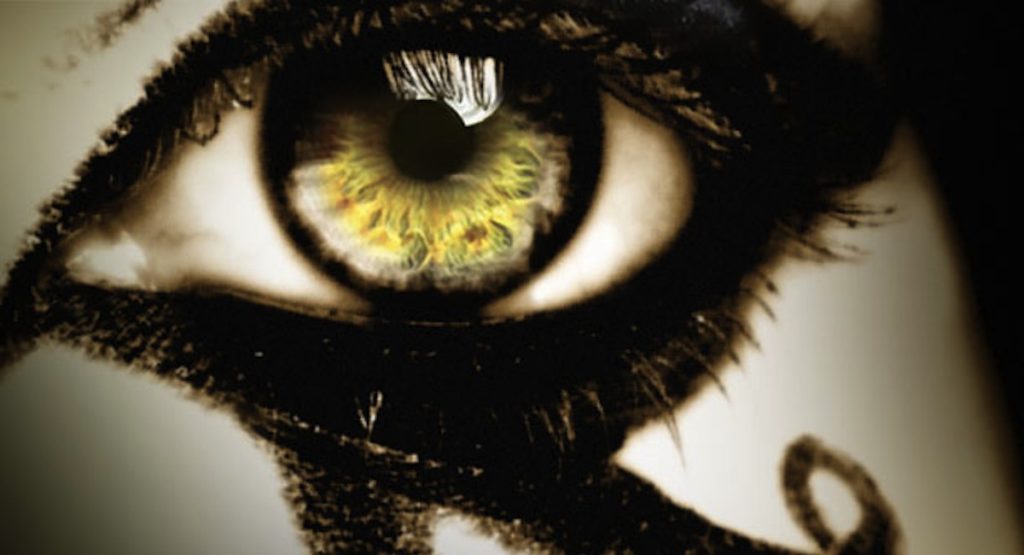 Human Eye with Yellow Iris and Black Eyeliner