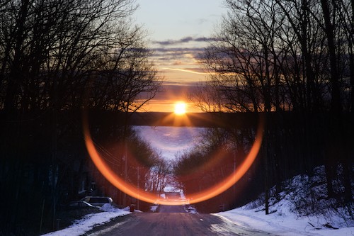 West Pine Drive spring equinox lens flare sunrise West pine Drive equinox sunrise, Higgins Lake, Michigan