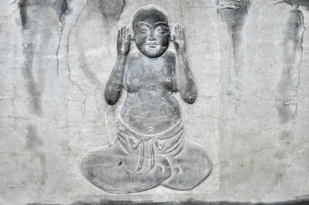 Stone Carving of Seated Buddha with Palms Facing Up